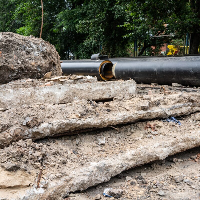 Insulated huge pipes and concrete slabs on city road